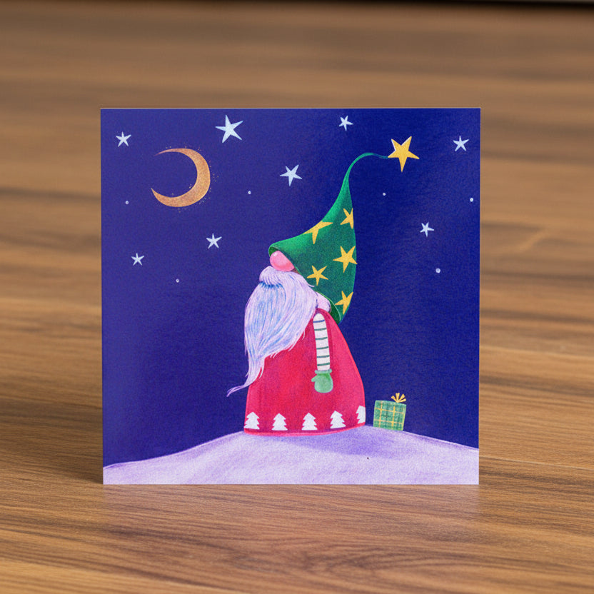 Illustration of a gnome with a starry hat under a night sky with stars and a moon.