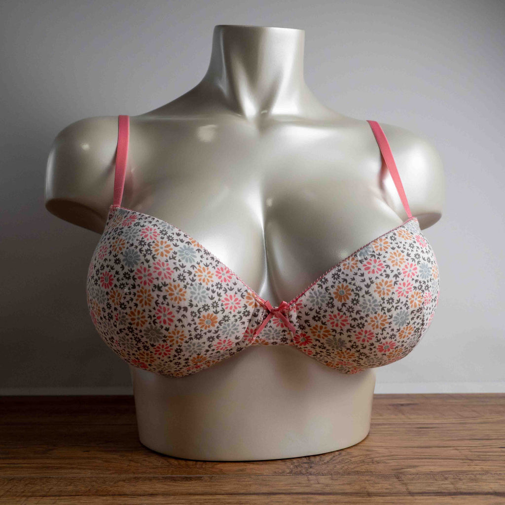 Royce white floral wire-free bra with pink straps and small pink bow detail.