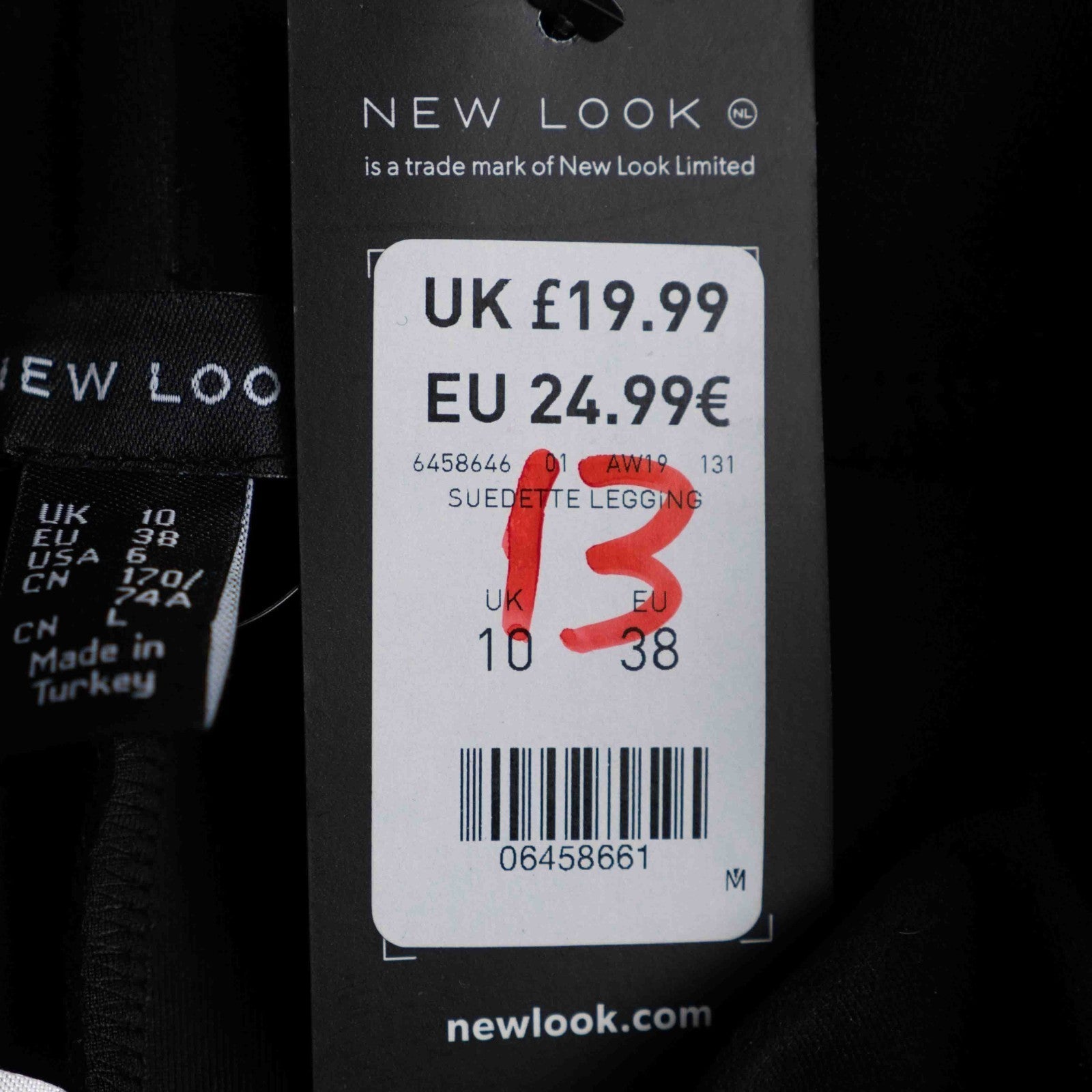 New Look black leggings with elasticated waistband and central line detail, size 10.