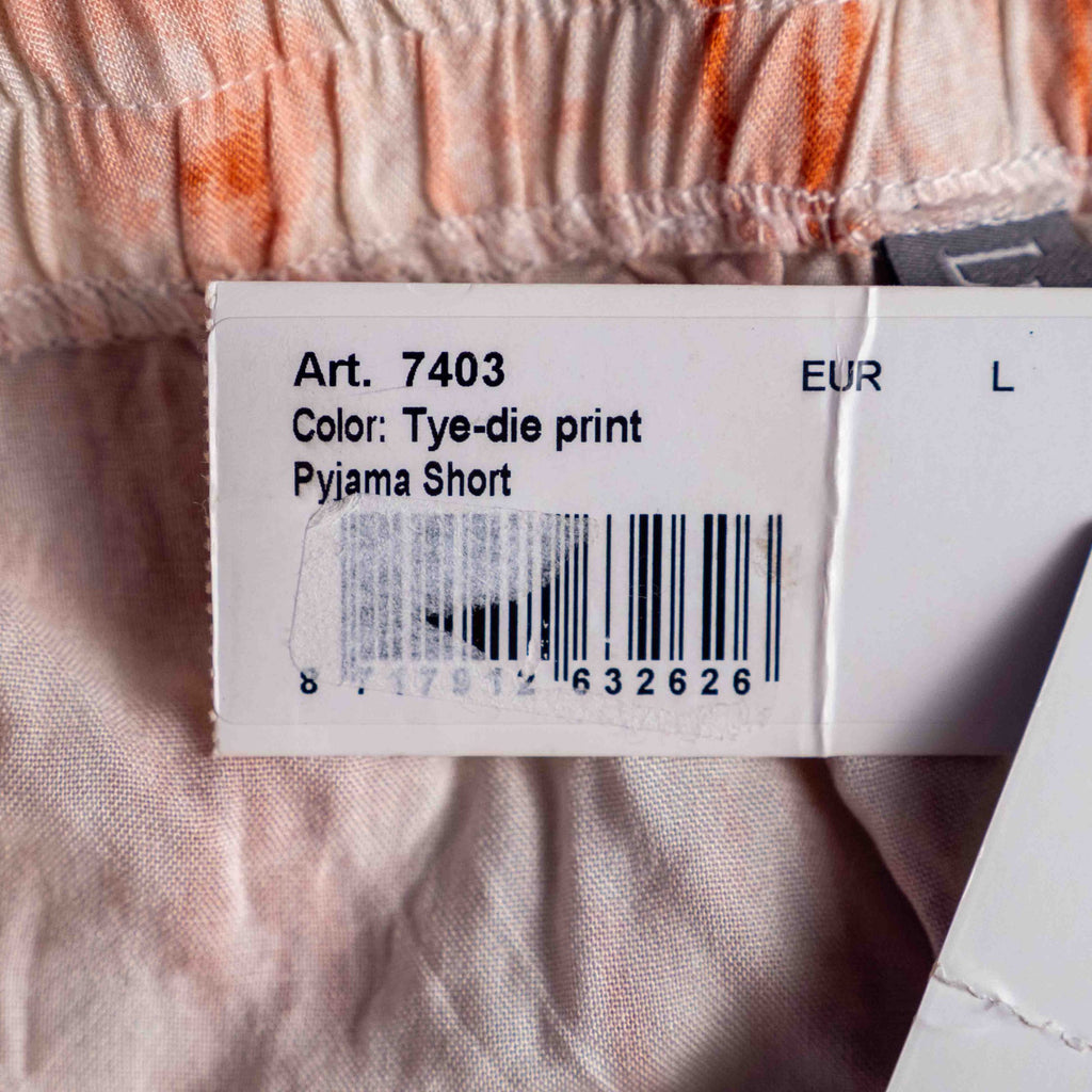 Lingadore orange and white tie-dye pyjama shorts with elastic waistband and drawstring tassels.