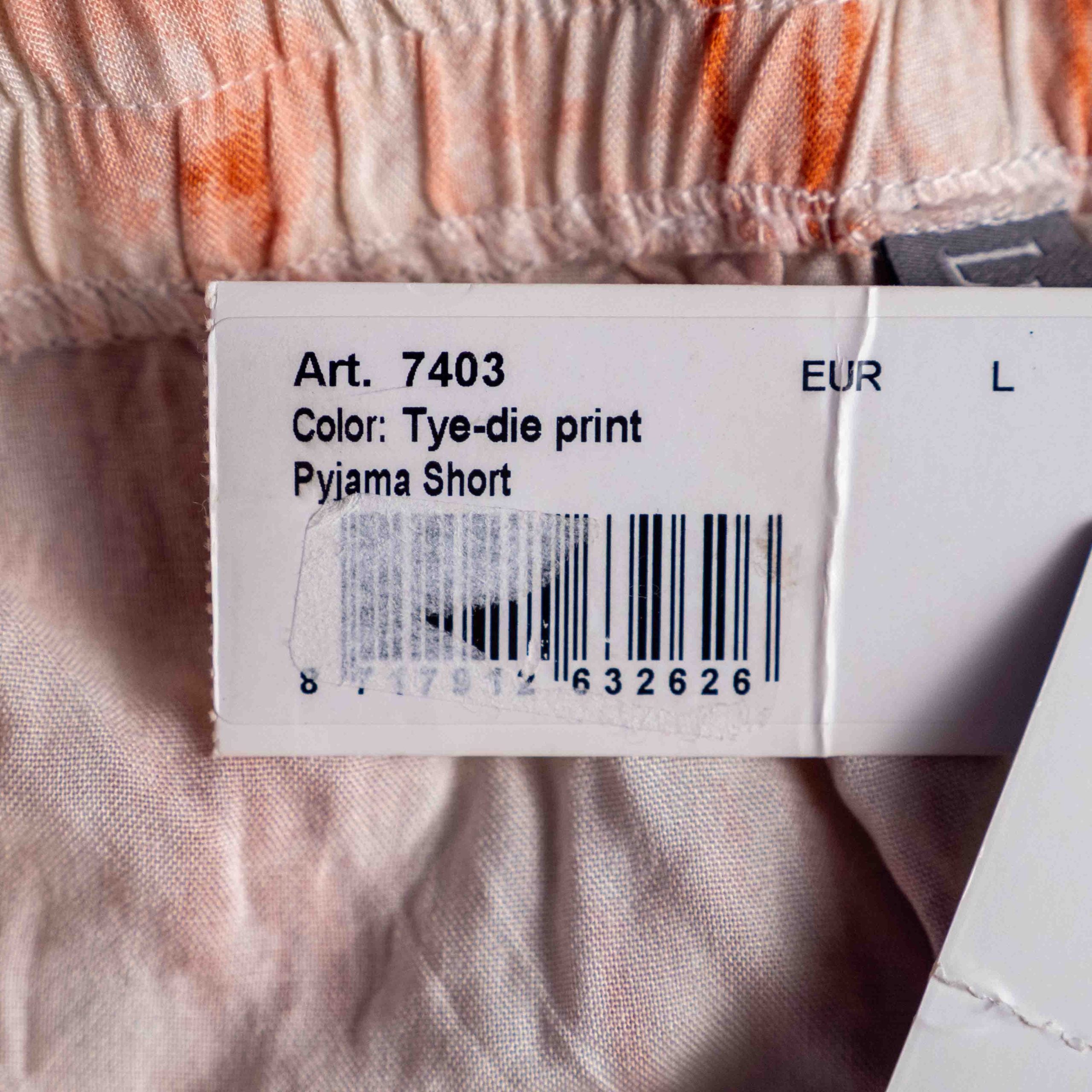 Lingadore orange and white tie-dye pyjama shorts with elastic waistband and drawstring tassels.