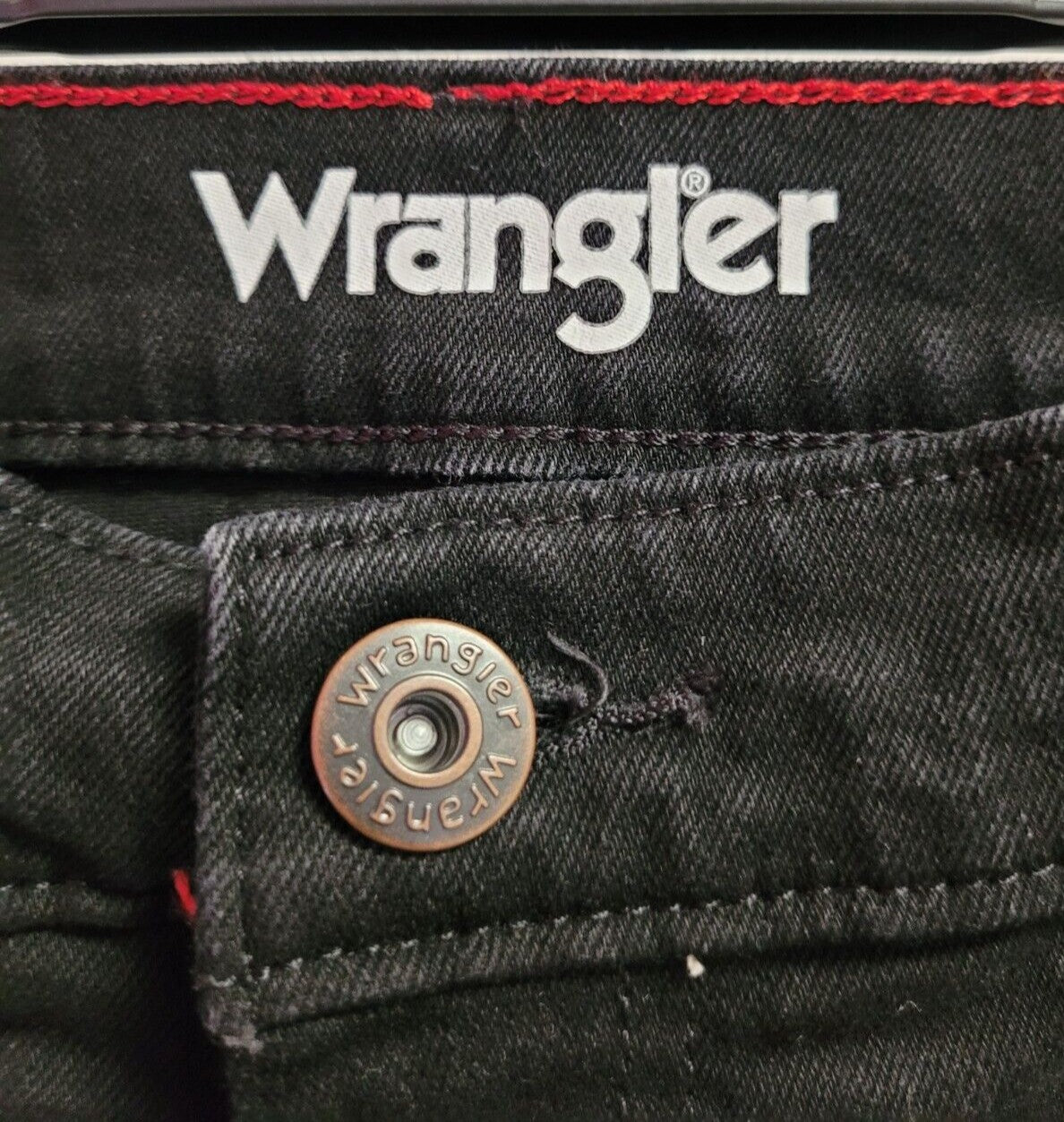 Wrangler black straight leg jeans with zip/button fly and five pockets.