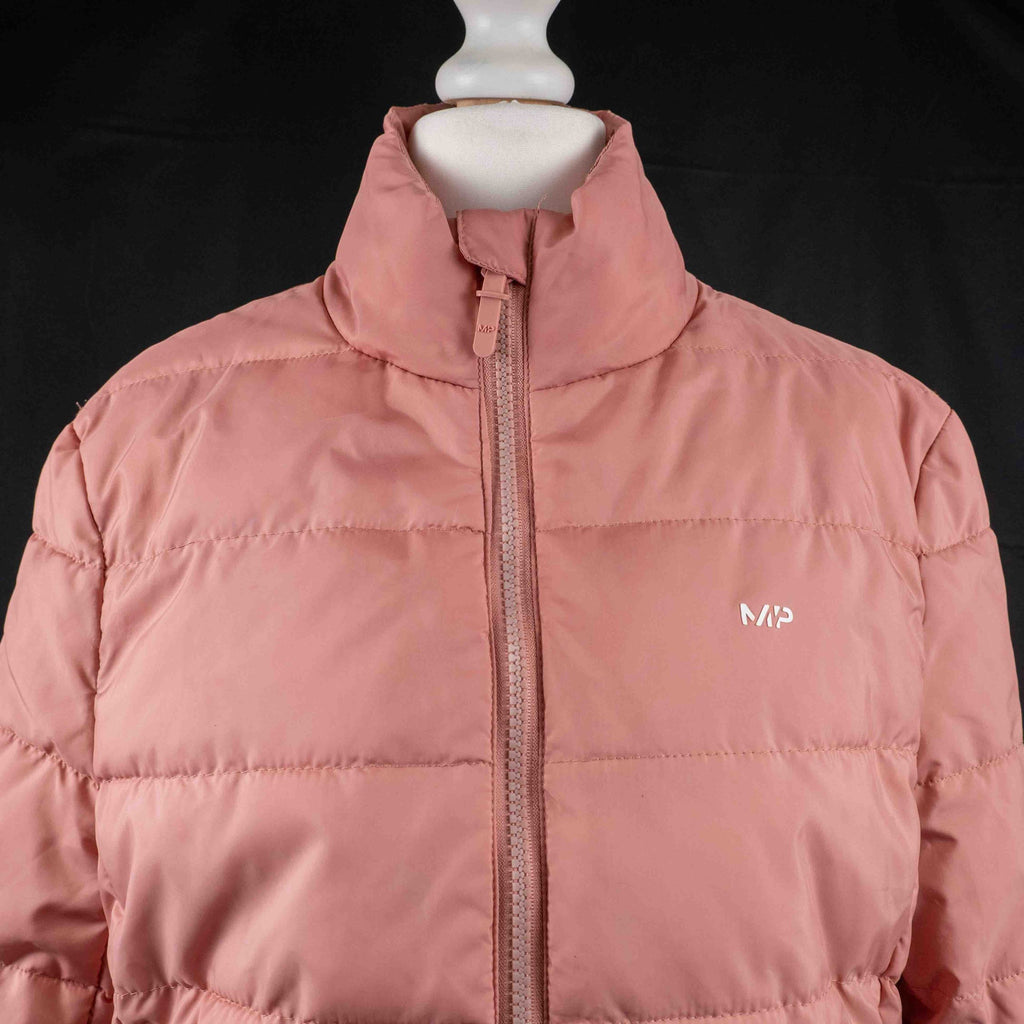 MP pink zip up puffer jacket with horizontal quilting and minimal logo on chest.