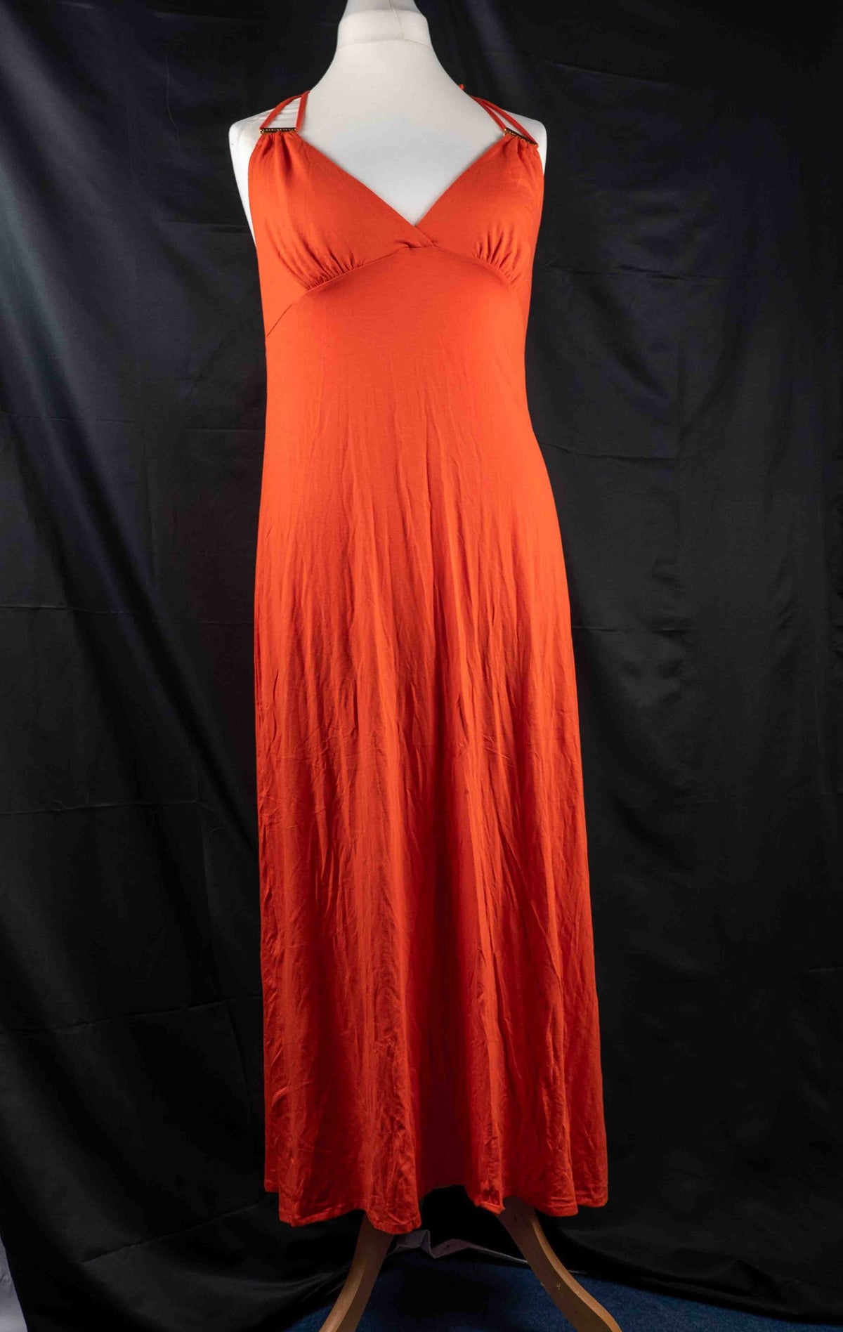 Bisbigli orange maxi dress with gold bar detailing on shoulder straps, lace material.