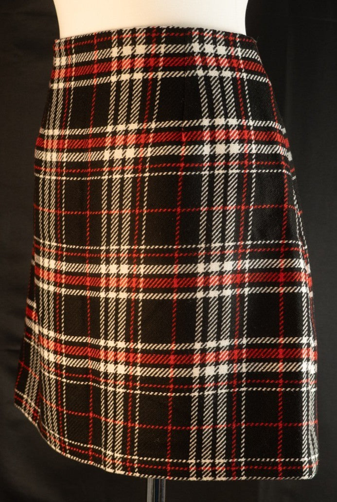 Papaya tan mini skirt black, red, and white checked pattern with zip and button closure.