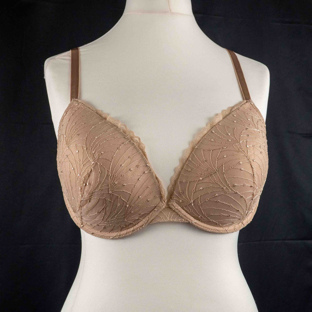 Wacoal beige and black underwired bras with floral lace design and adjustable straps.