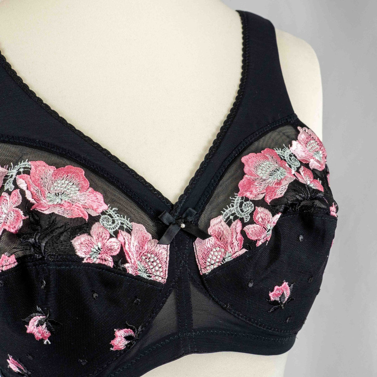 Glamorise black floral bra with pink and white pattern, adjustable straps, non-padded design.