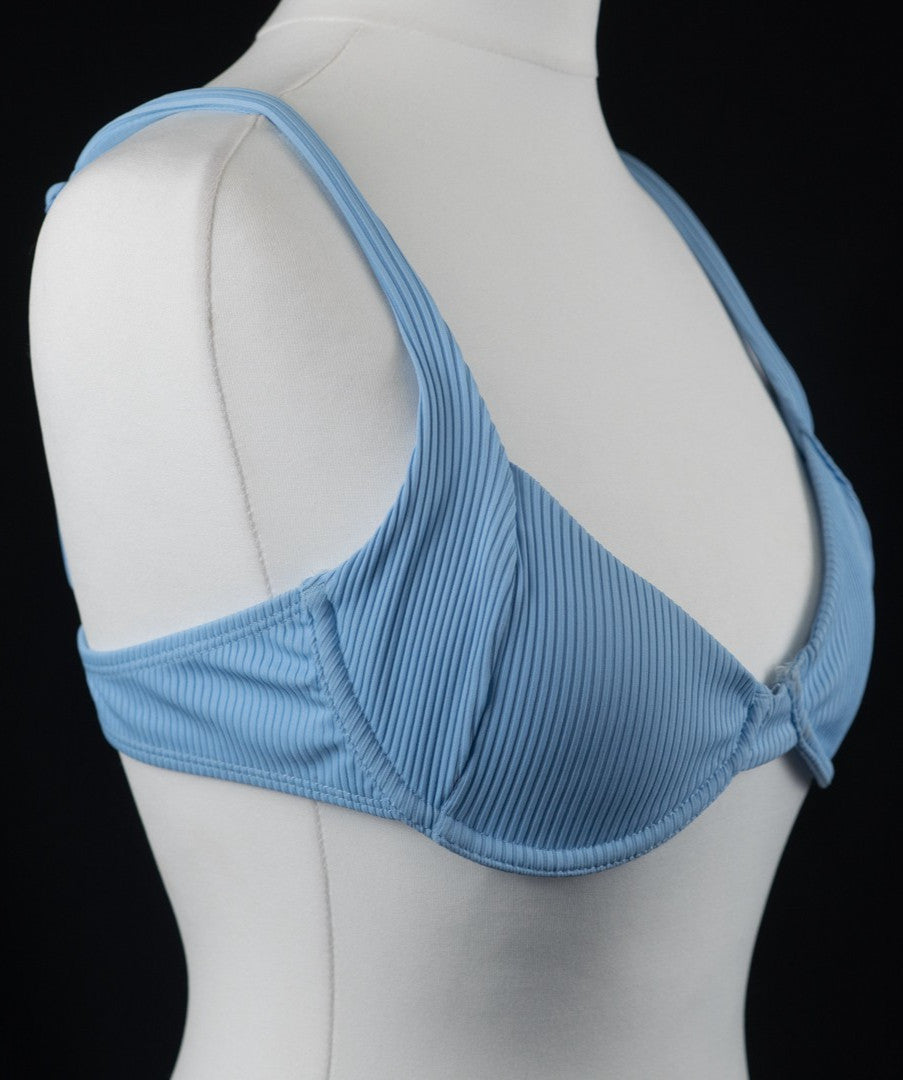 Bershka blue bikini top with line pattern, underwired, padded, and back buckle closure.