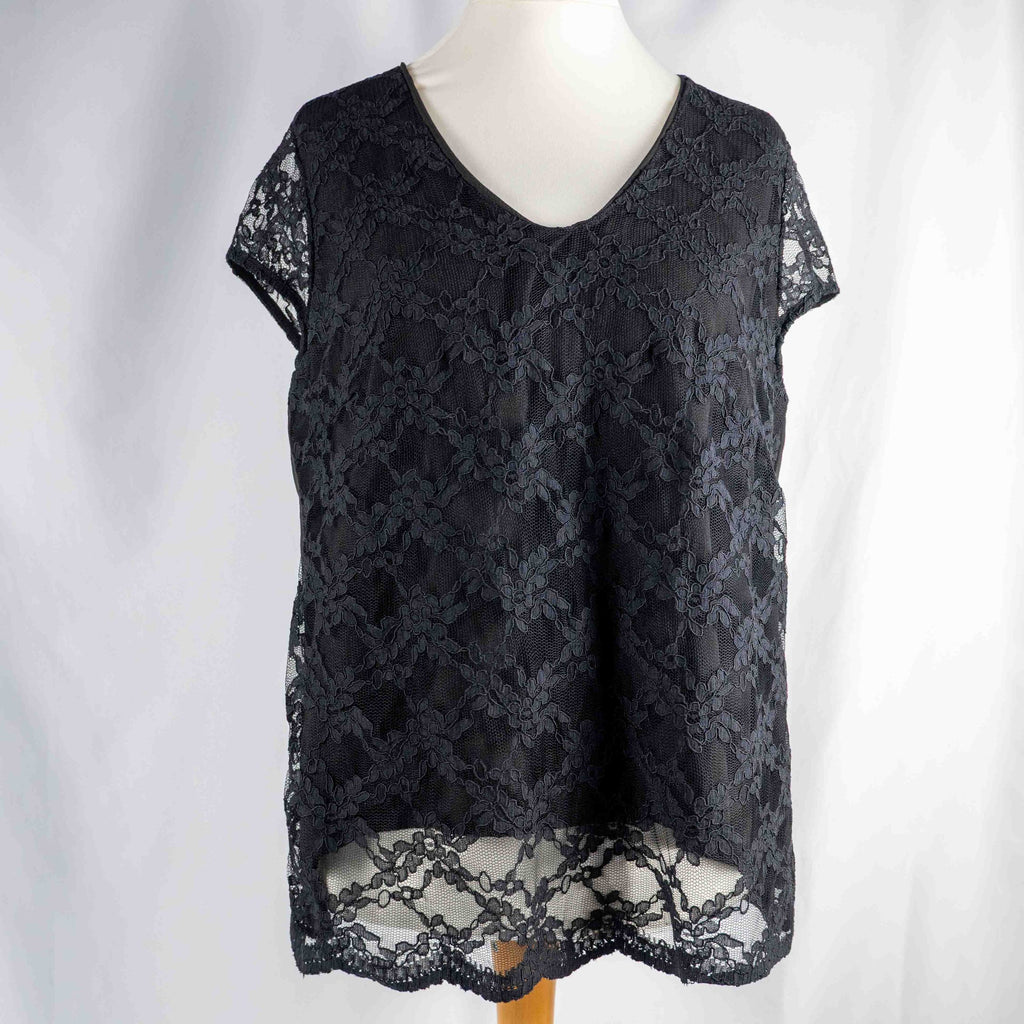Black lace sleeve top with V neckline and tie-back detail, feminine style.