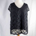 Black lace sleeve top with V neckline and tie-back detail, feminine style.