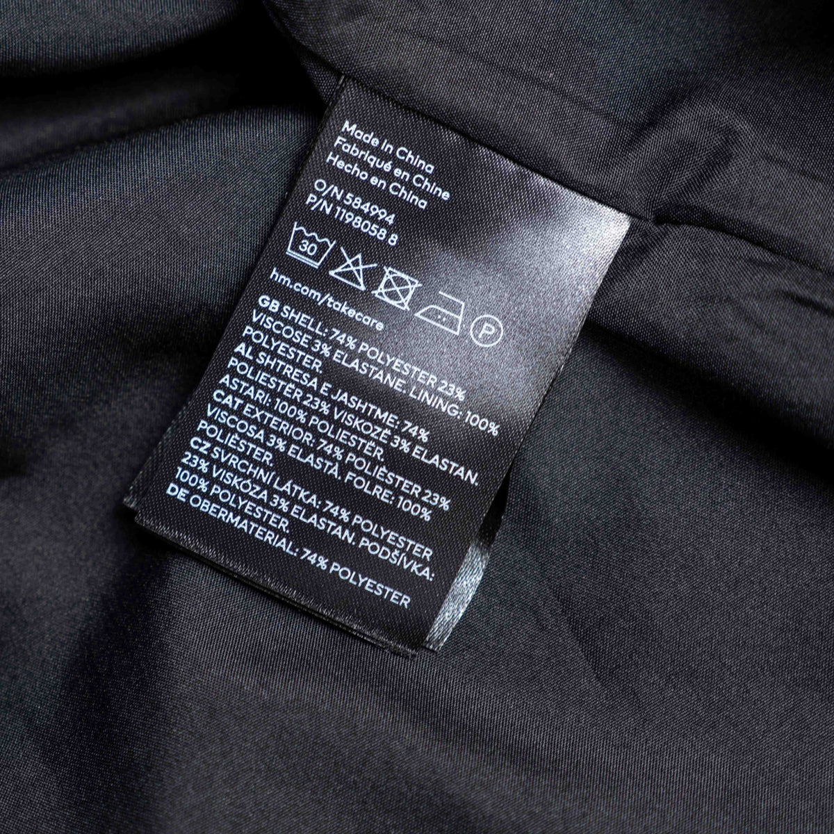 H&M black double-breasted blazer with structured lapel and six front buttons.