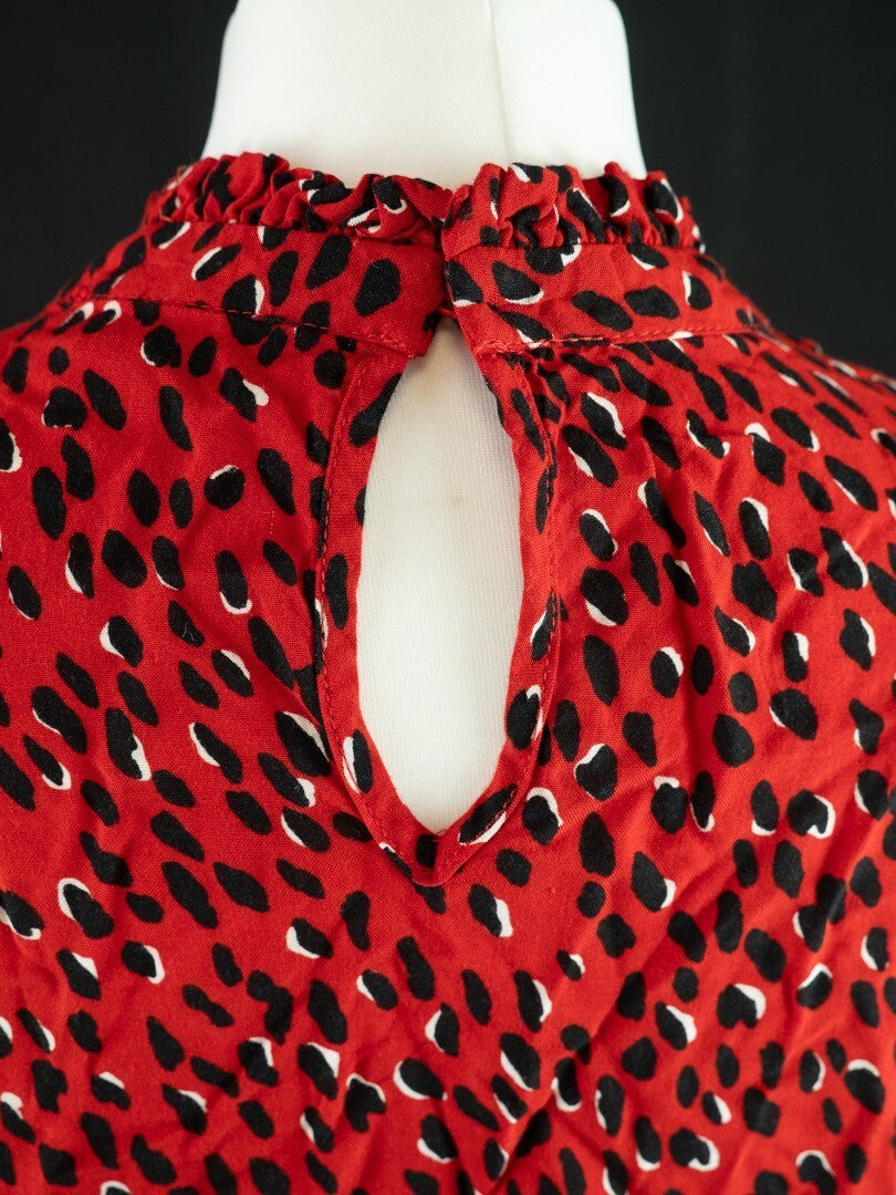 New Look red blouse with black accents, high neck, single button, 100% viscose.