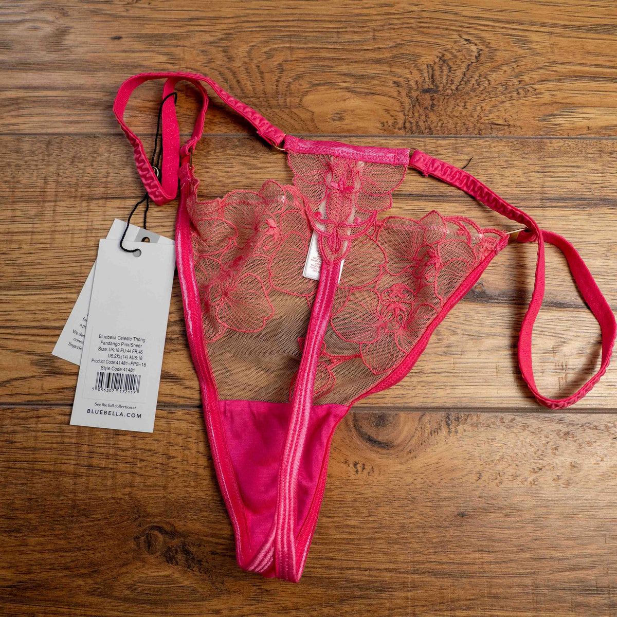 Bluebella pink lingerie thong with sheer floral lace detailing and adjustable straps.