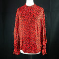 New Look red blouse with black accents, high neck, single button, 100% viscose.