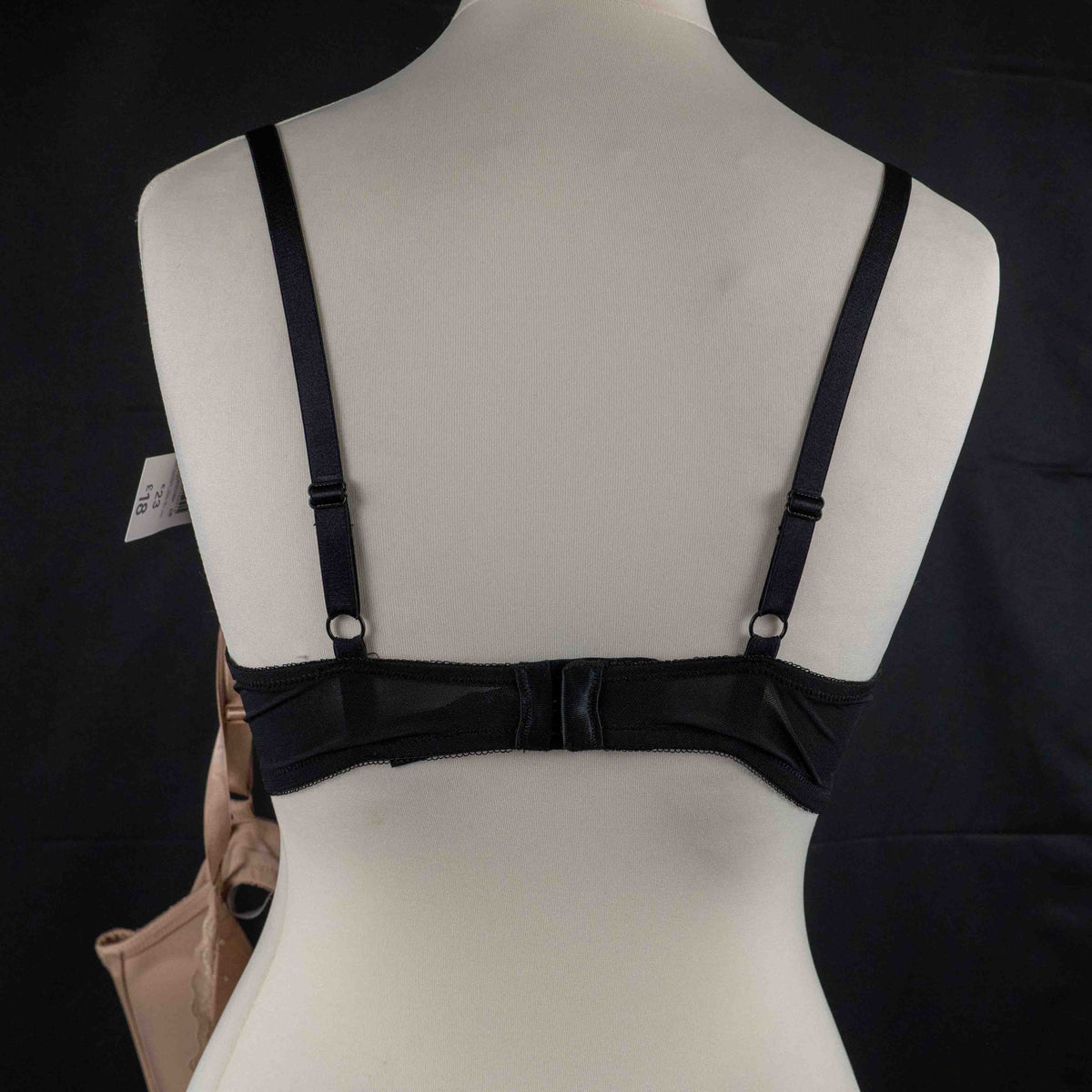 Wacoal beige and black underwired bras with floral lace design and adjustable straps.