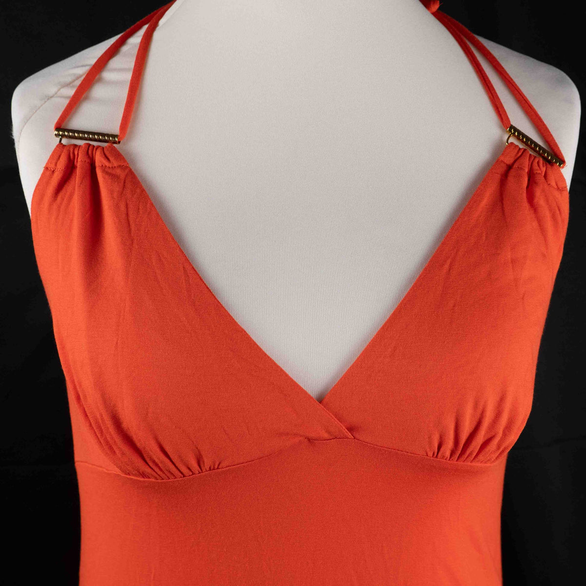 Bisbigli orange maxi dress with gold bar detailing on shoulder straps, lace material.