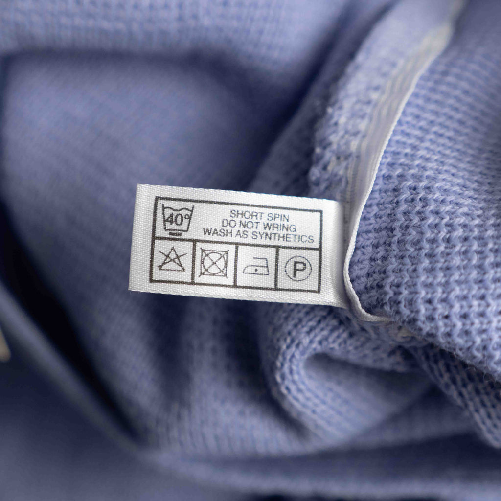 Care lilac cardigan with V-neck, five buttons, two pockets, ribbed trim.