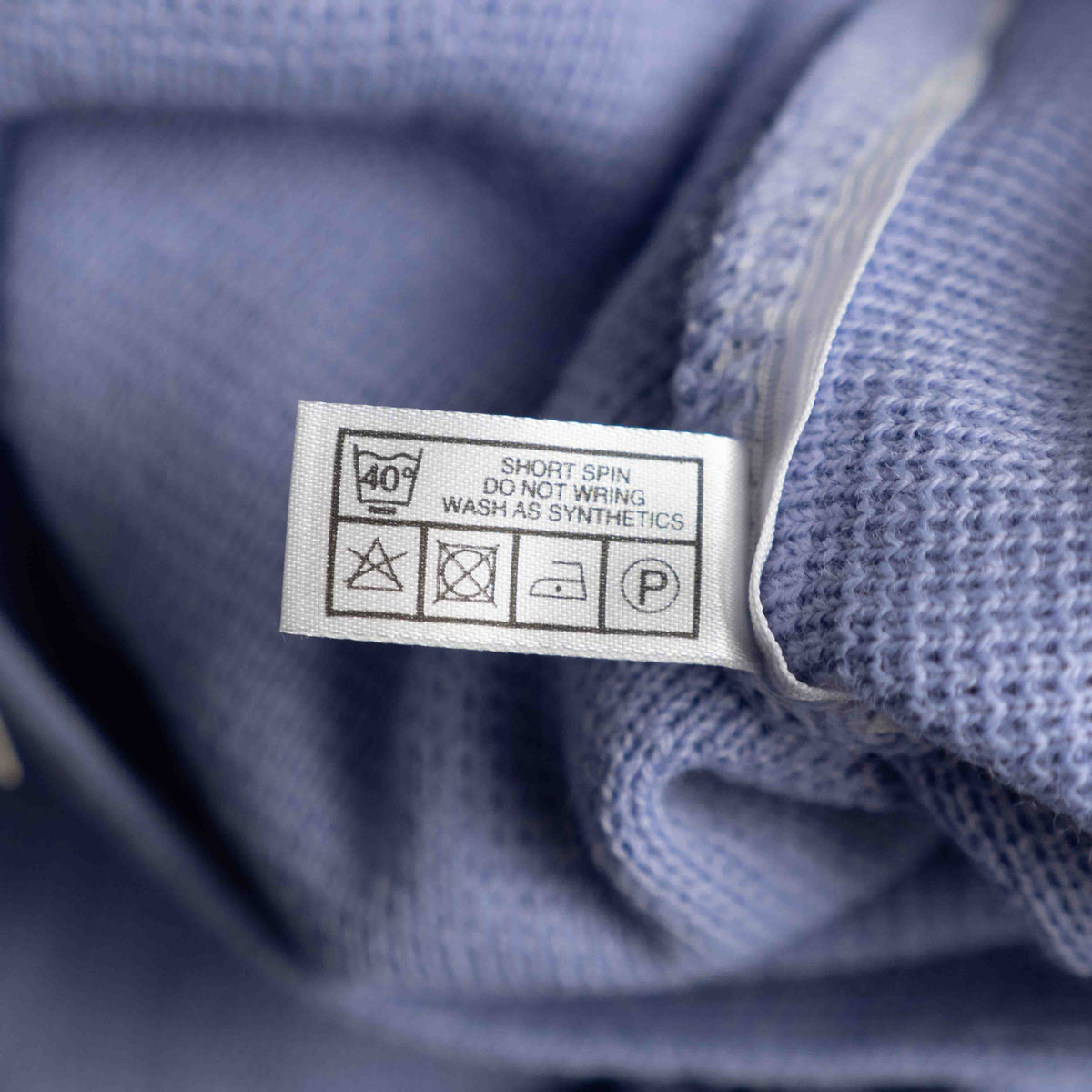 Care lilac cardigan with V-neck, five buttons, two pockets, ribbed trim.