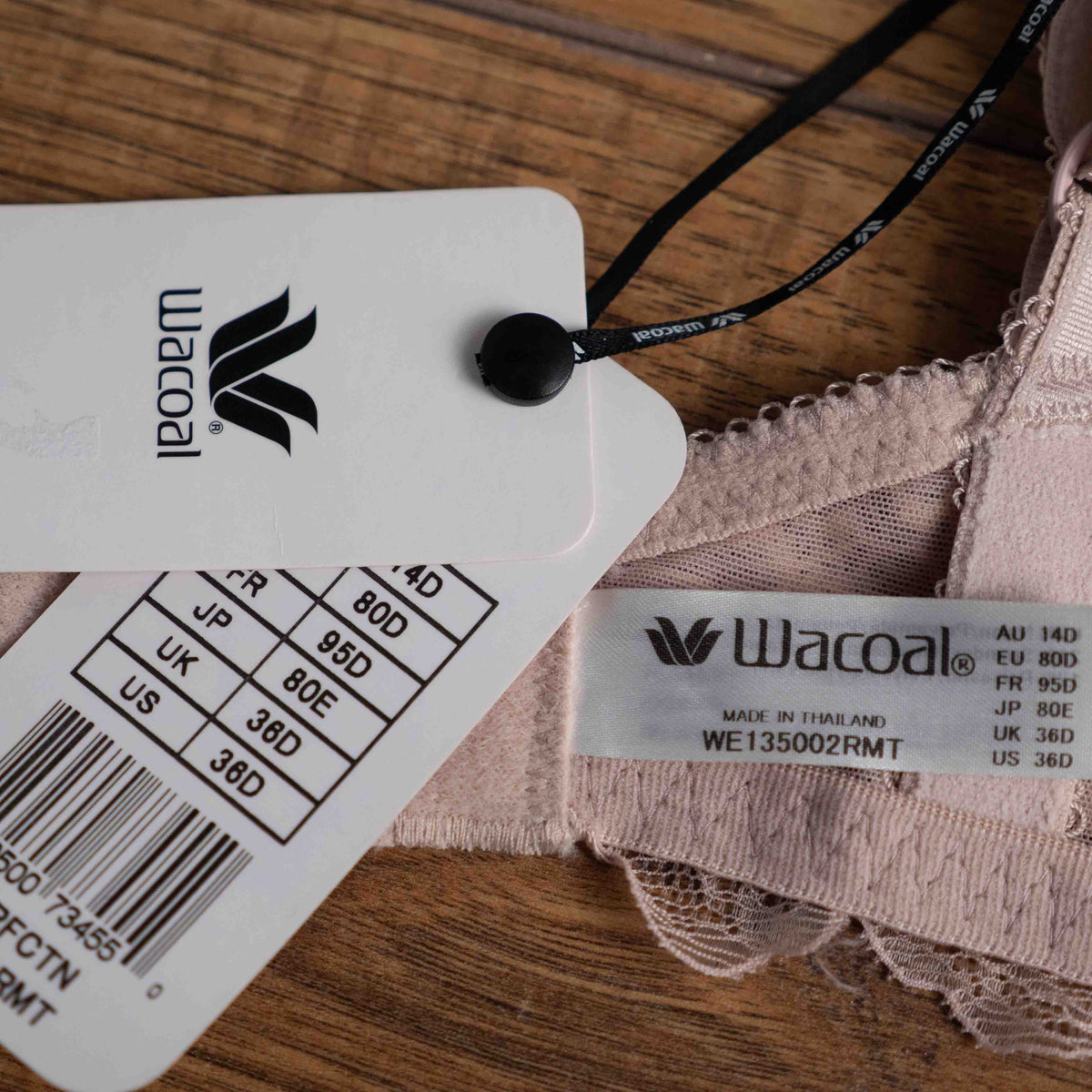 Wacoal dusty pink underwired bra with delicate lace detailing and adjustable straps.