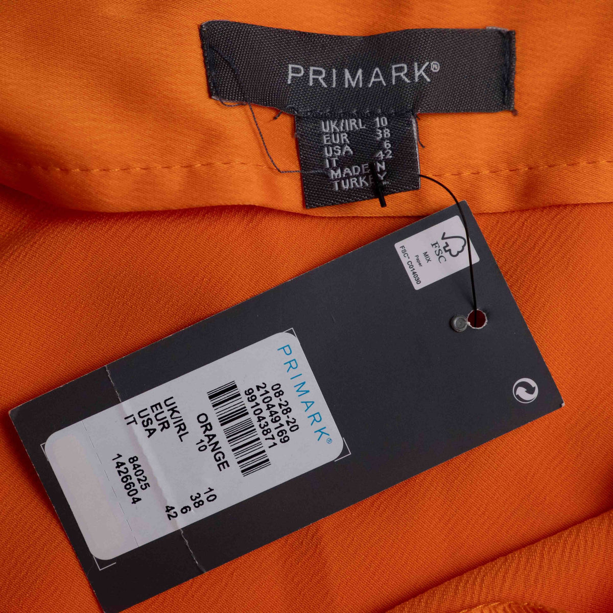 Primark orange slip dress with adjustable spaghetti straps and cowl neckline.