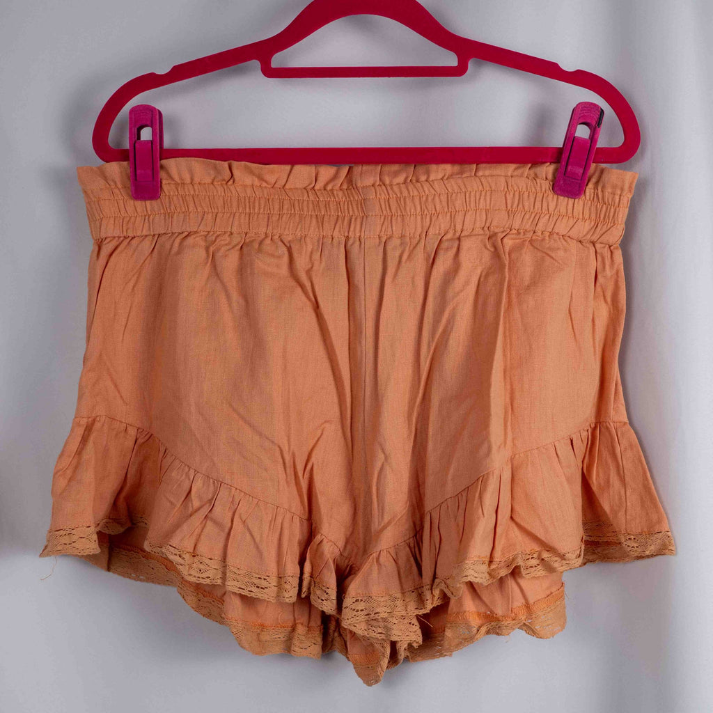 Boohoo orange linen ruffle shorts with lace trim and elasticated waistband.