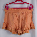 Boohoo orange linen ruffle shorts with lace trim and elasticated waistband.
