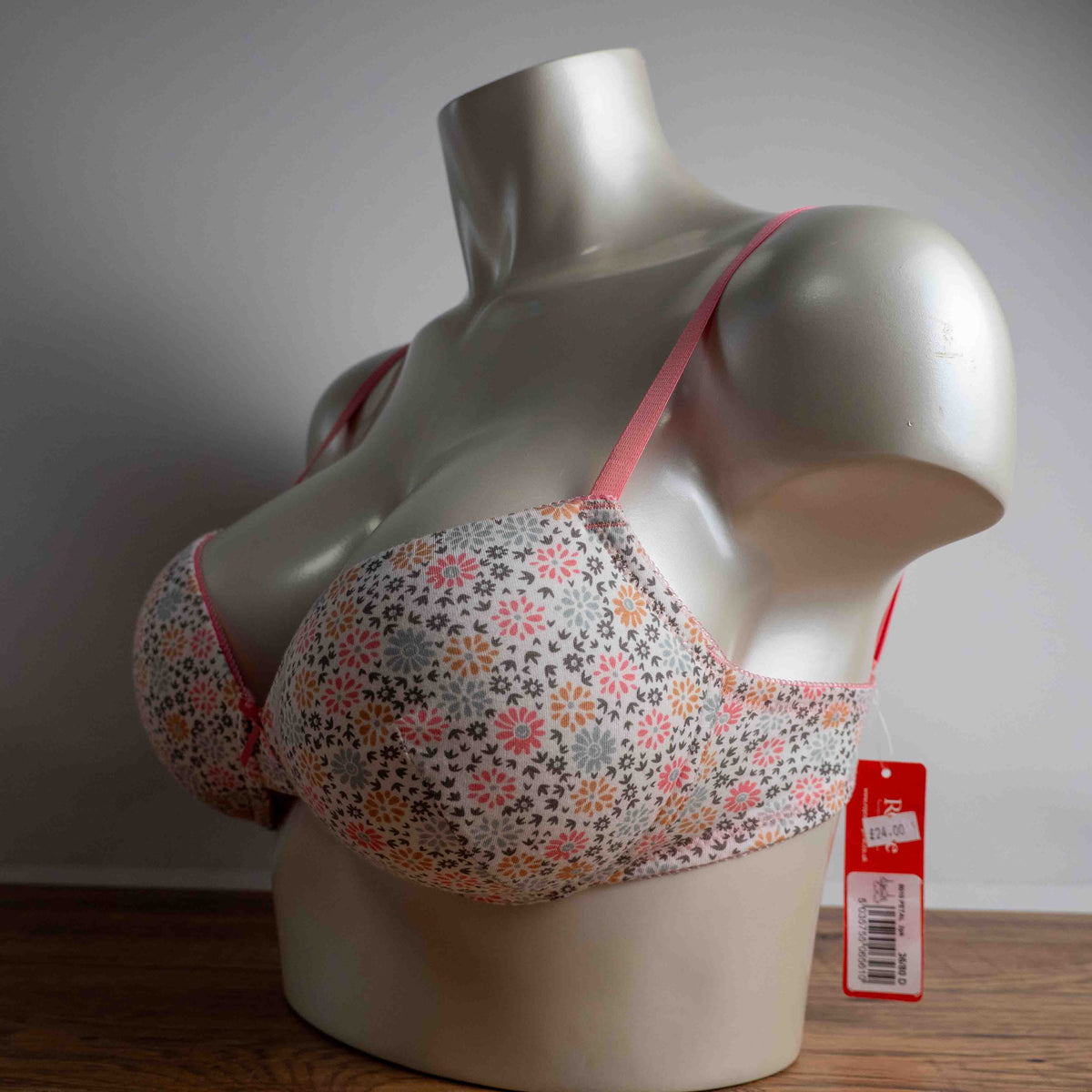 Royce white floral wire-free bra with pink straps and small pink bow detail.