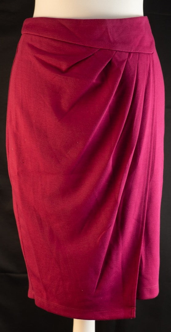 Next pink mini skirt with back zip closure and pleated front, new with tag.