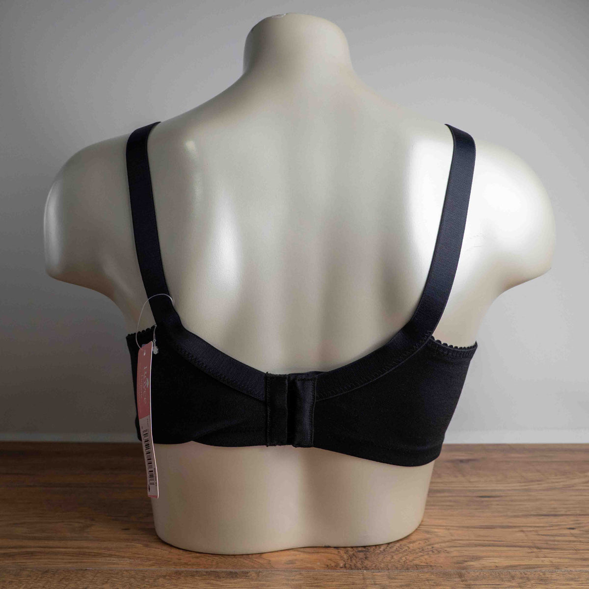 Anonymous black lace bra with soft cups and adjustable straps, brand new with tags.