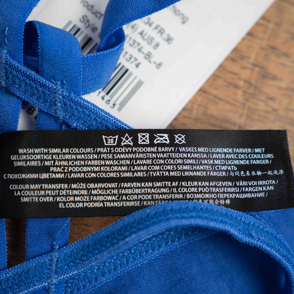 Bluebella blue lace thong with mesh detailing and elastic waistband featuring logo.