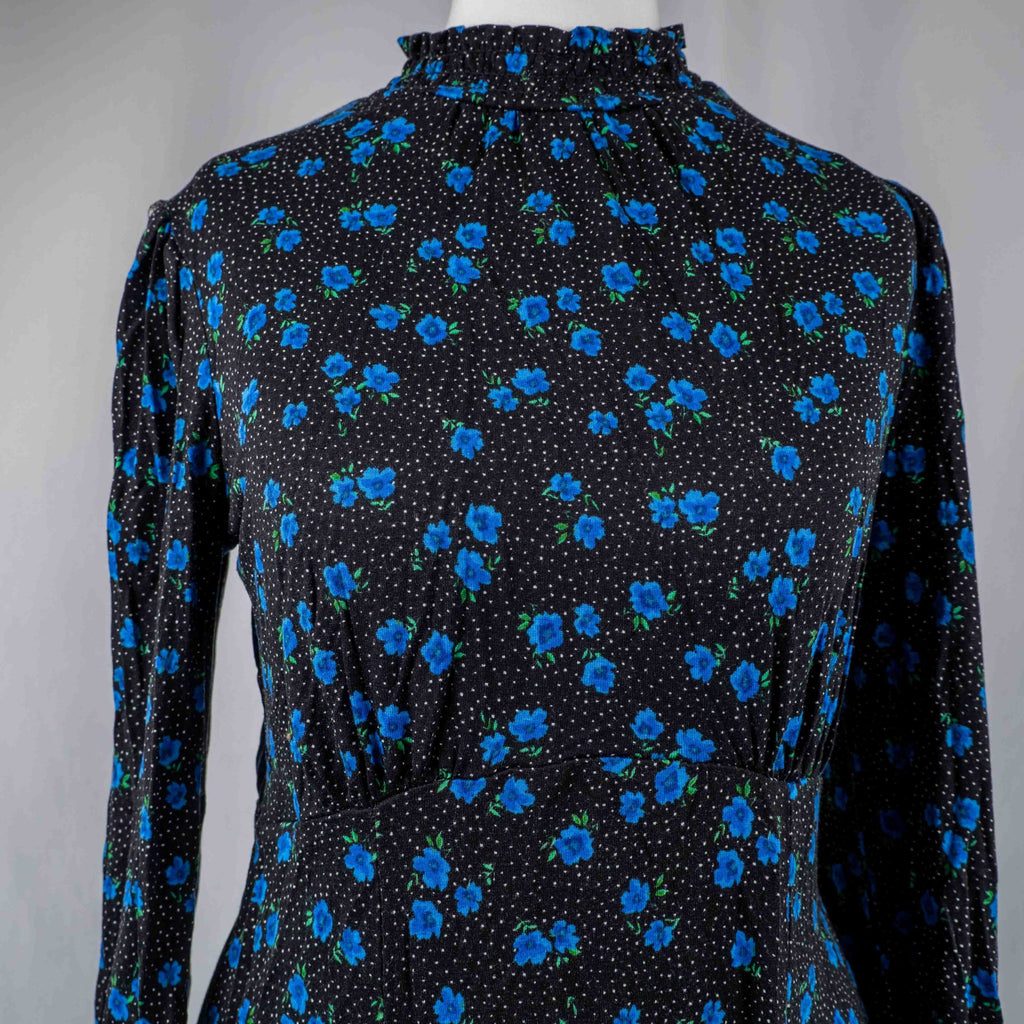 New Look black dress with blue floral print, ruffled high neckline, long sleeves.