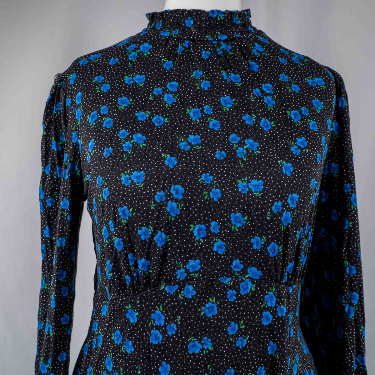 New Look black dress with blue floral print, ruffled high neckline, long sleeves.