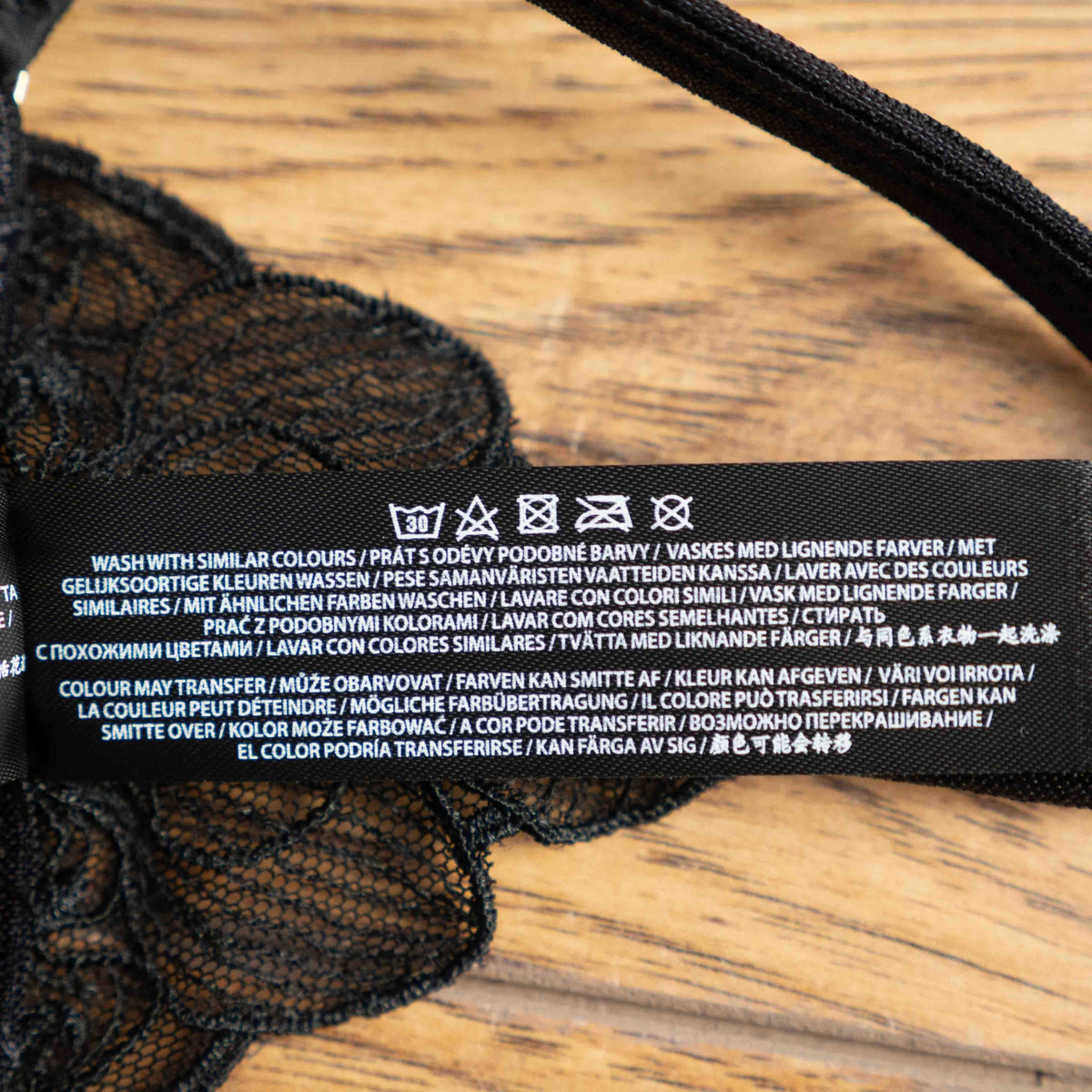 Bluebella black lace thong with floral pattern and sheer mesh design, adjustable straps.