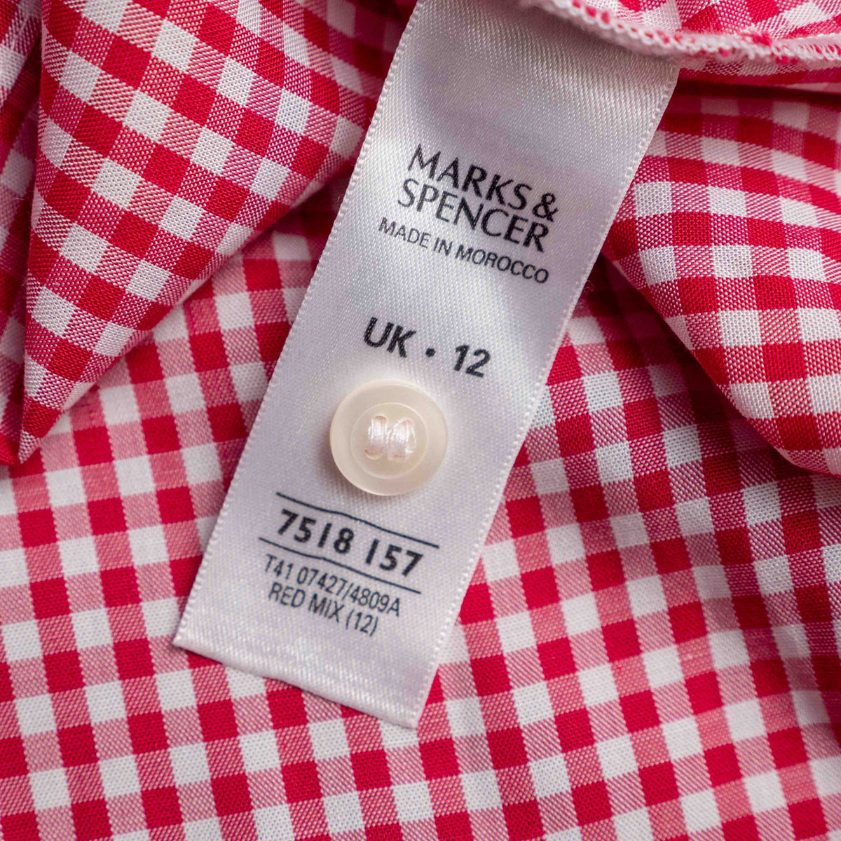 Marks & Spencer red and white gingham sleeveless shirt with classic collar and chest pocket.