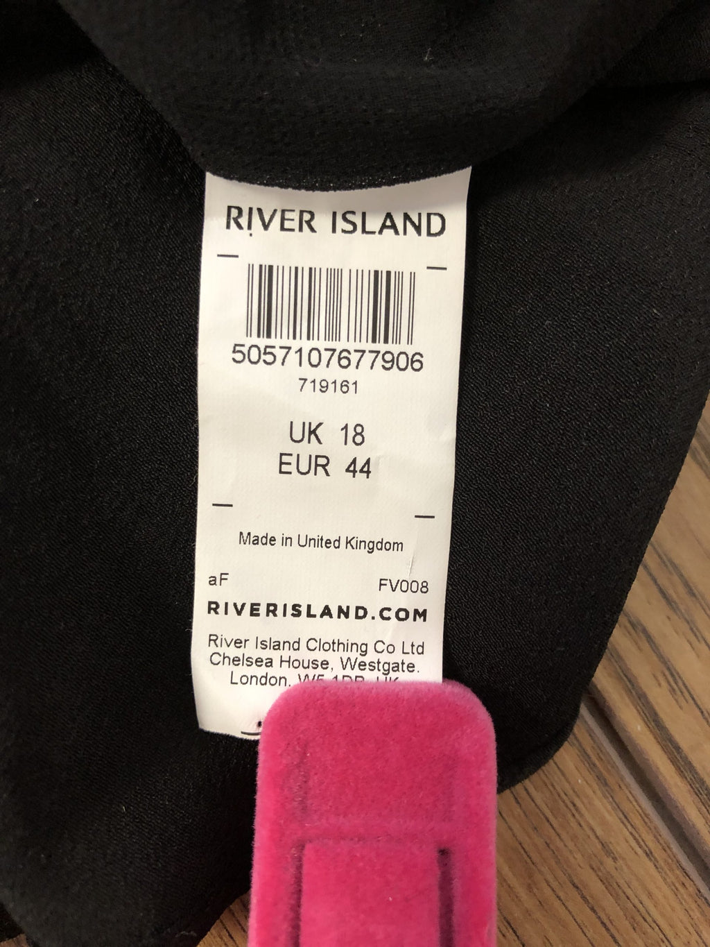 River Island black peplum cami top with button details and adjustable straps.
