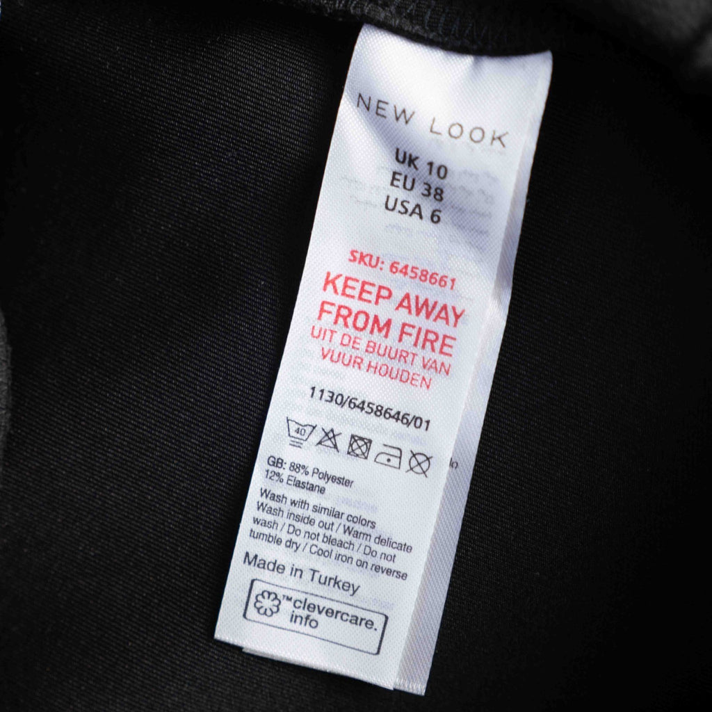 New Look black leggings with elasticated waistband and central line detail, size 10.