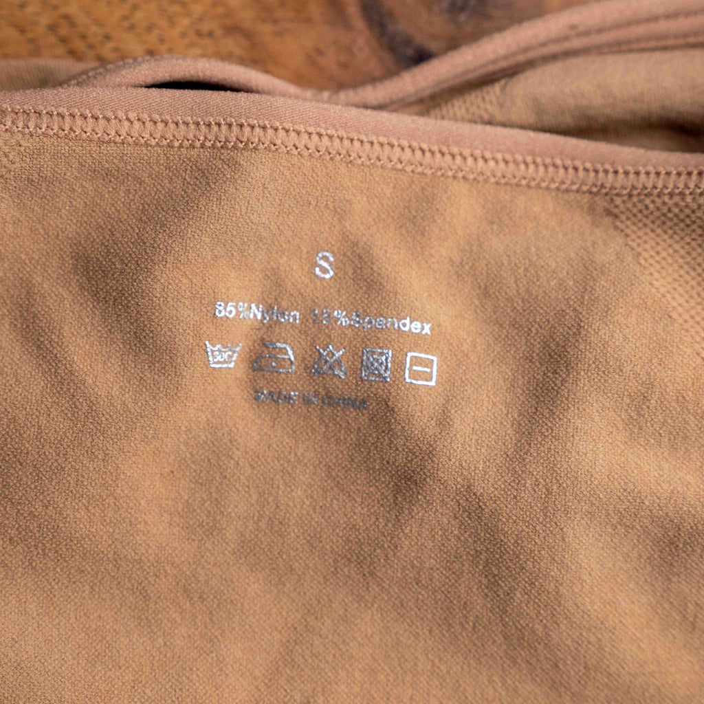 Dyvers light brown seamless bra with adjustable straps and soft ruched fabric.
