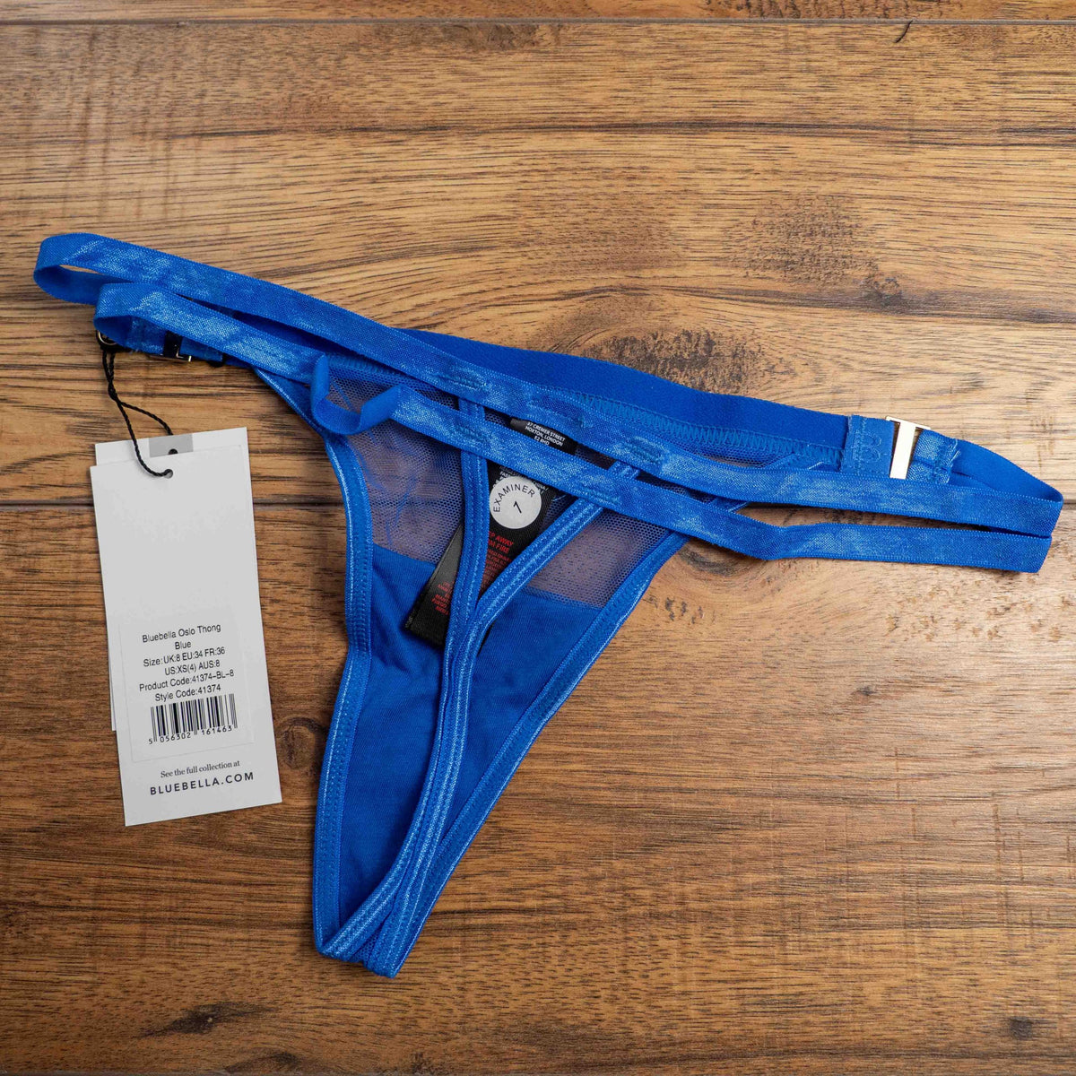Bluebella blue lace thong with mesh detailing and elastic waistband featuring logo.