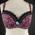 Debenhams pink and red floral bra with black lace trim and adjustable straps.