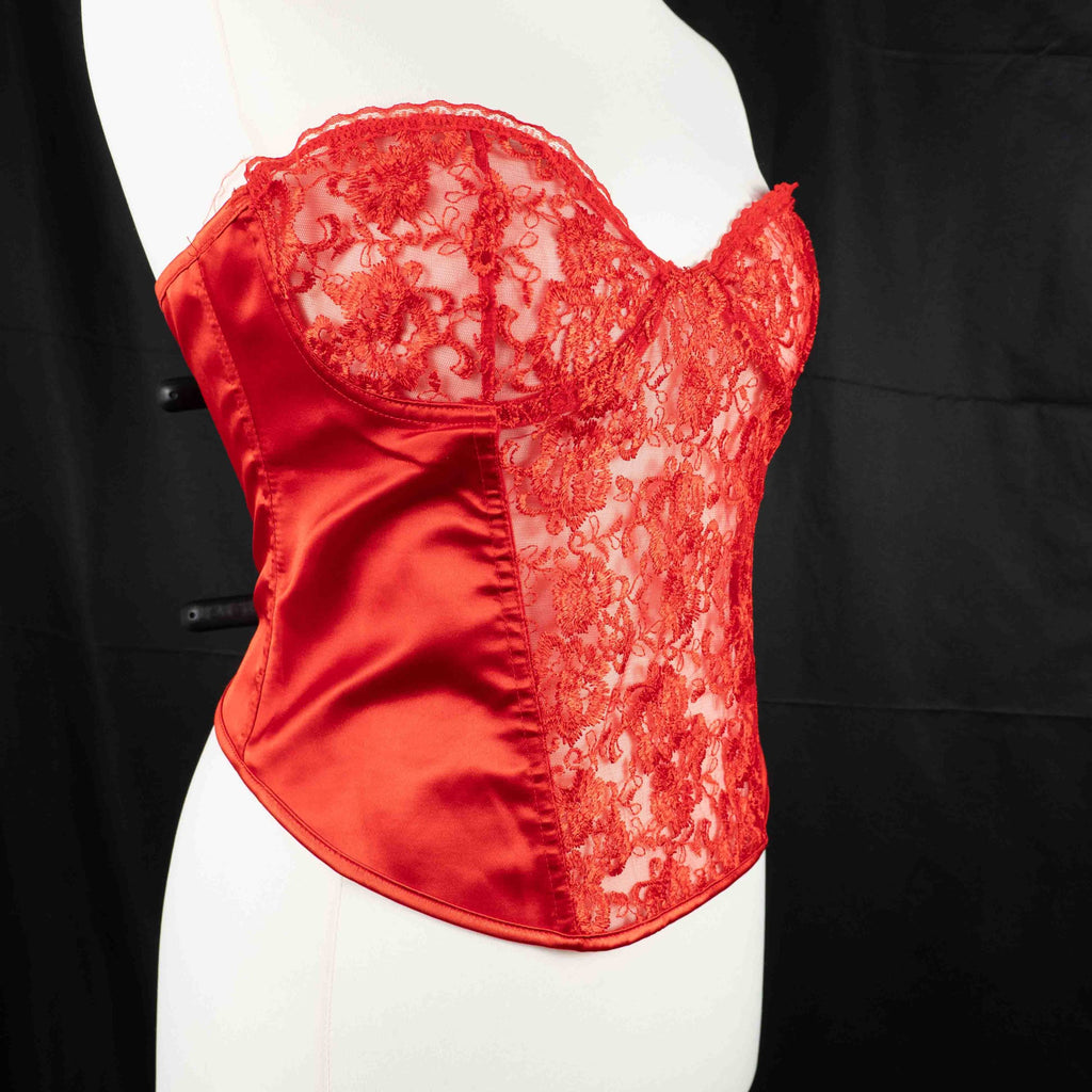 Red corset top with sheer floral lace bodice and satin sides, adjustable lace-up back.