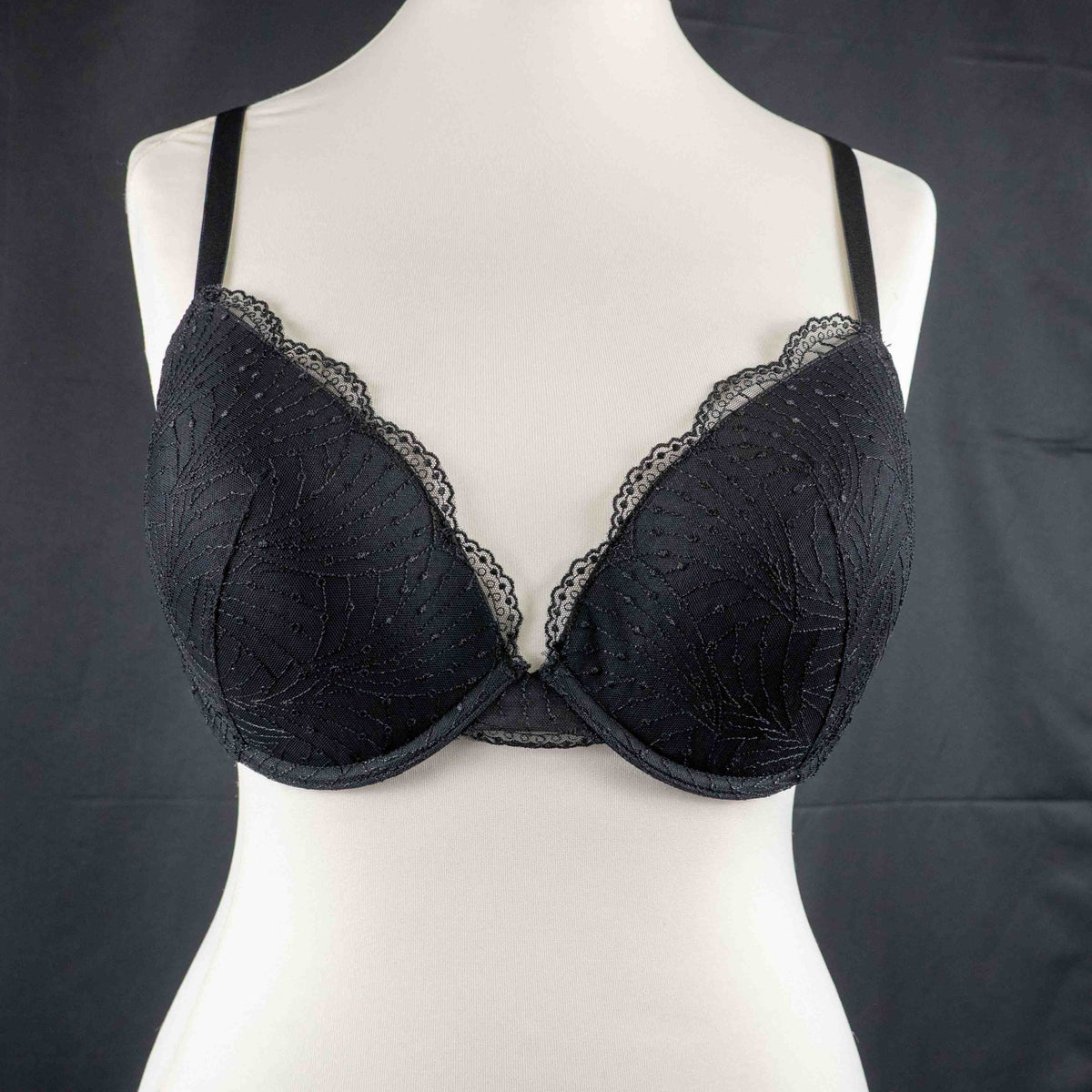 Wacoal beige and black underwired bras with floral lace design and adjustable straps.