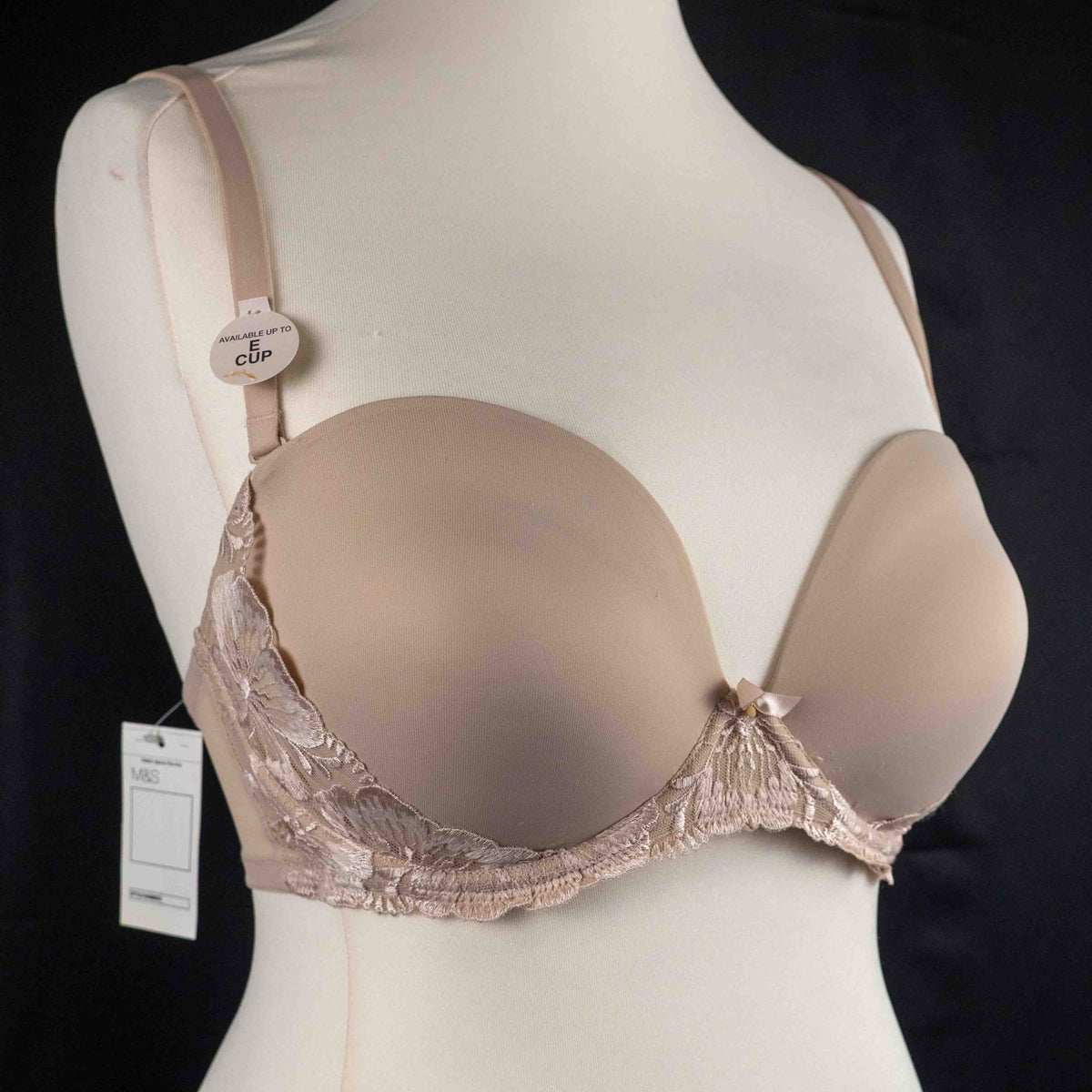 Marks and Spencer beige padded underwired bra with floral lace detail and decorative bow.