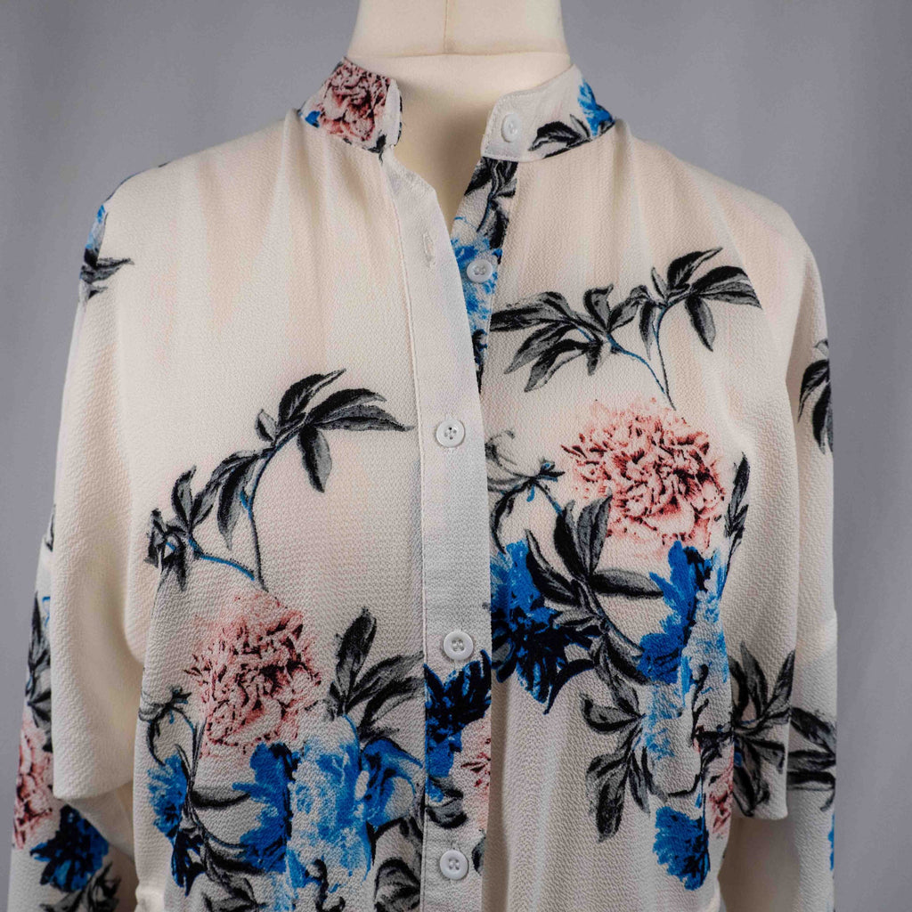 Boohoo white floral blouse with blue and pink prints, button front, drawstring waist.