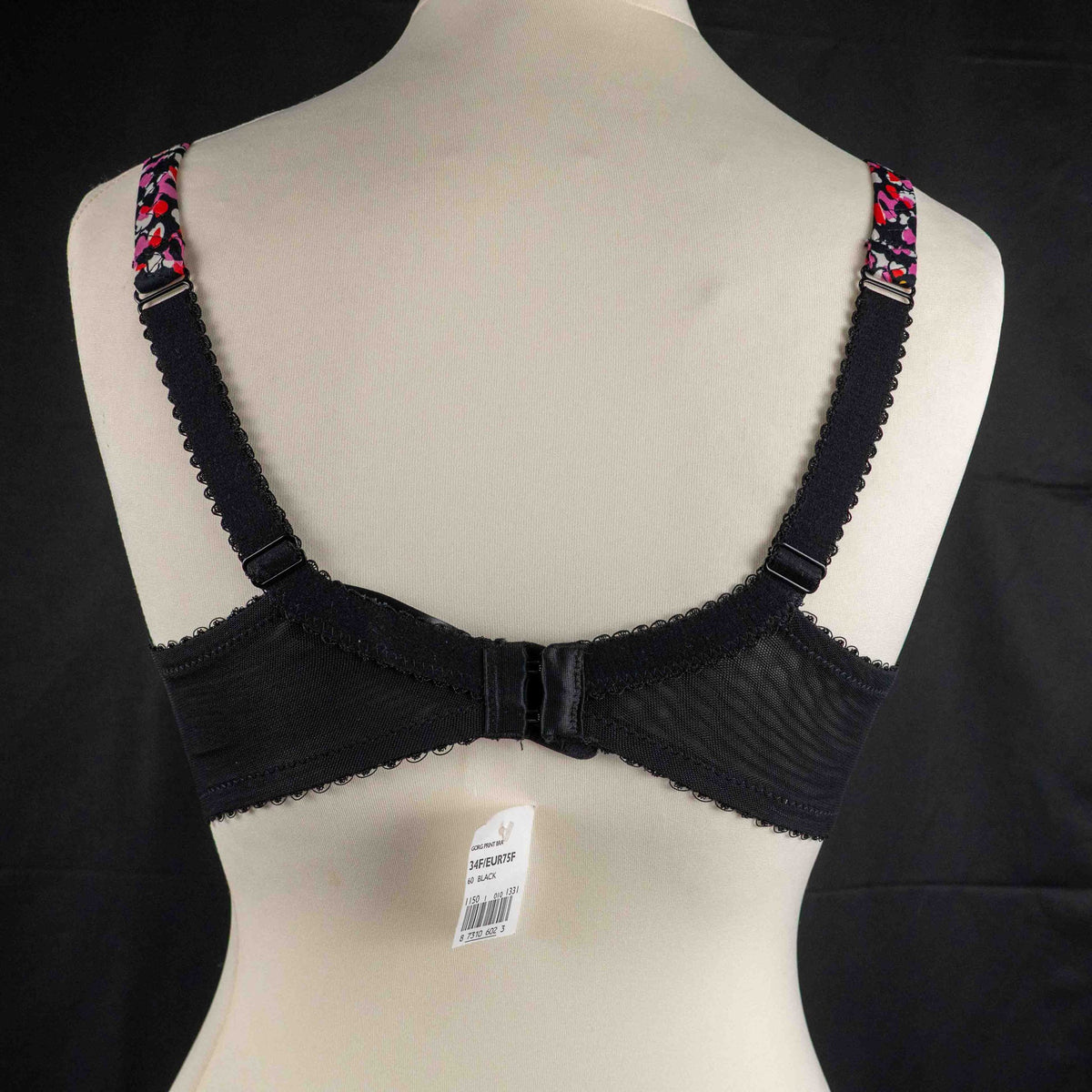 Debenhams pink and red floral bra with black lace trim and adjustable straps.