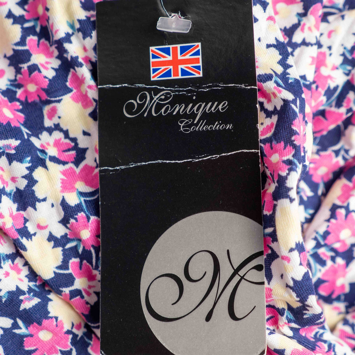 Monique Collection pink floral midi skirt with elastic waistband and soft viscose blend.