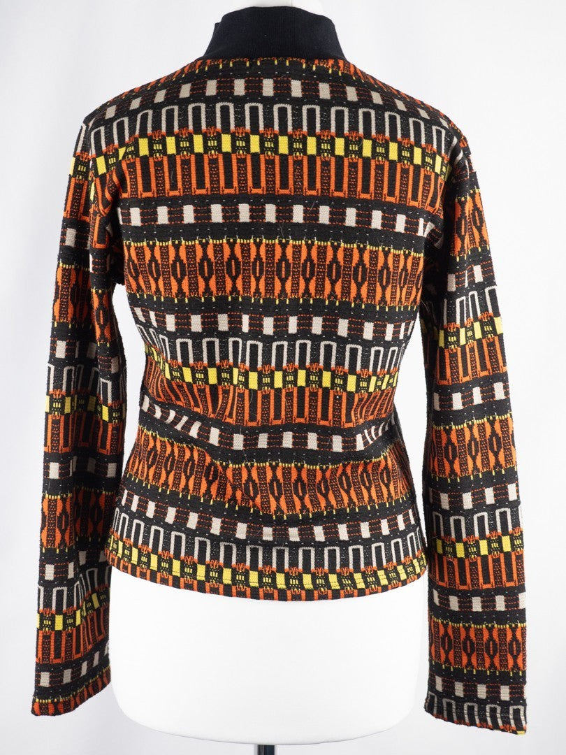 Zara black crewneck sweater with orange, yellow, and cream geometric pattern.