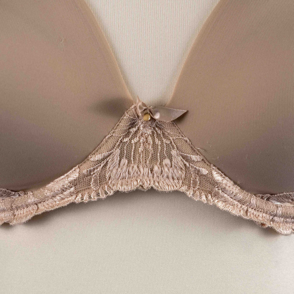 Marks and Spencer beige padded underwired bra with floral lace detail and decorative bow.