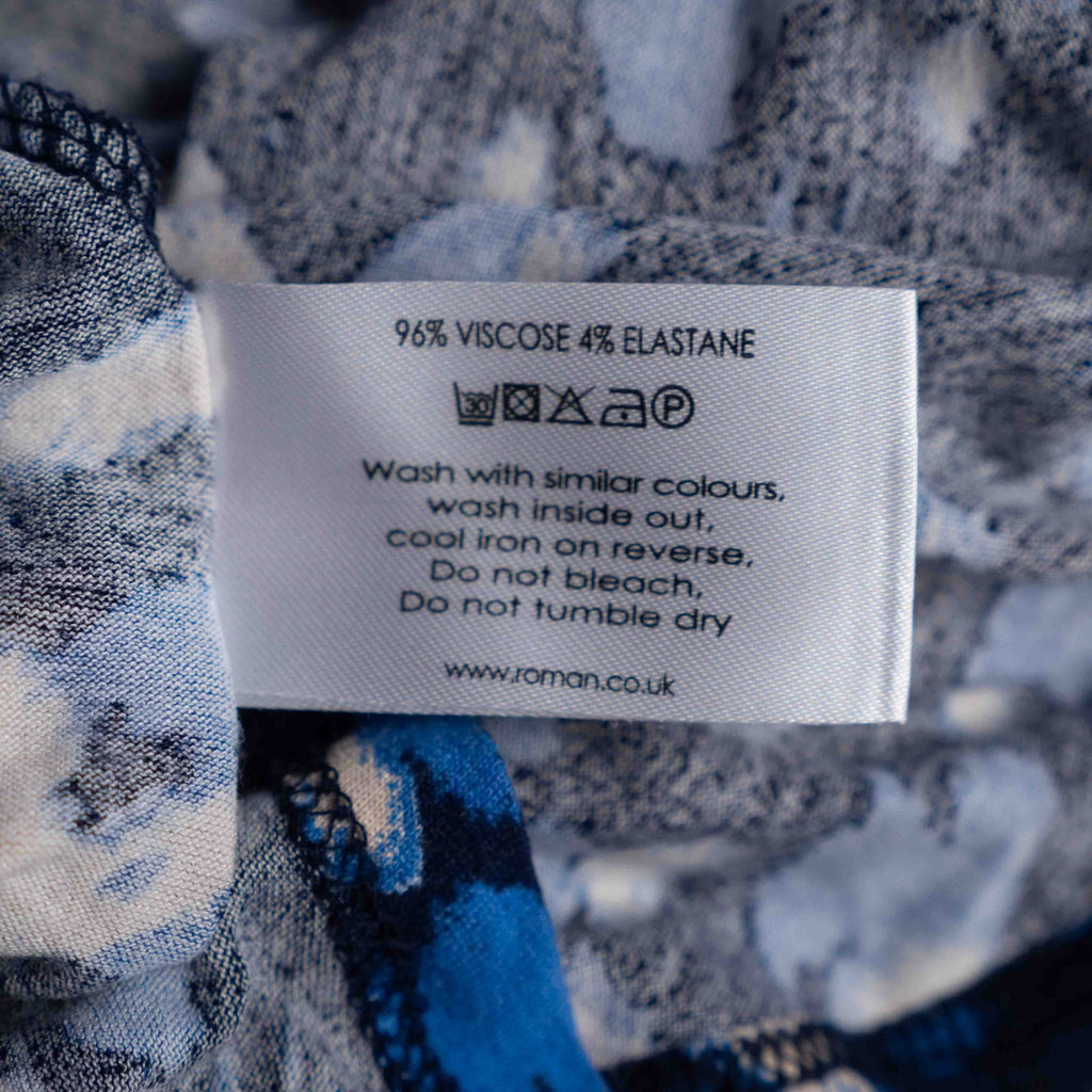Roman midi dress blue and white abstract pattern long sleeves fitted waist stretchy material.