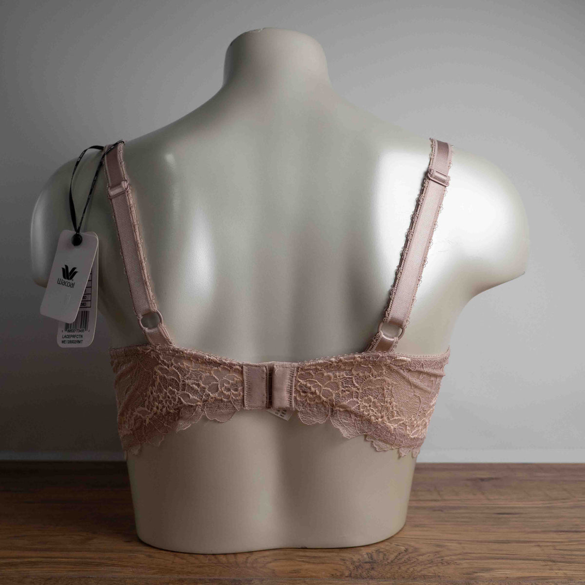 Wacoal dusty pink underwired bra with delicate lace detailing and adjustable straps.