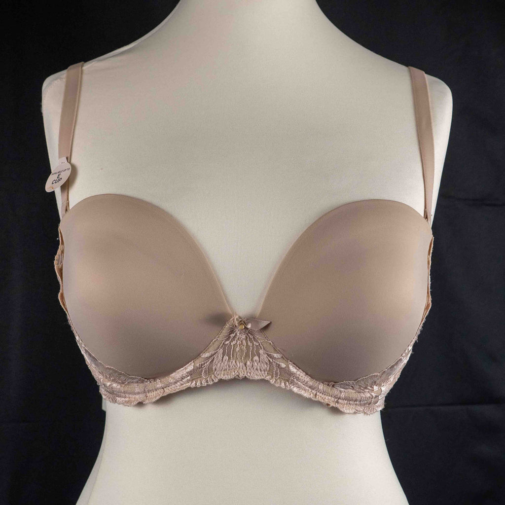 Marks and Spencer beige padded underwired bra with floral lace detail and decorative bow.